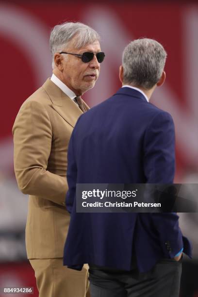 Los Angeles Rams owner Stan Kroenke talks with president Kevin Demoff before the NFL game against the Arizona Cardinals at the University of Phoenix...