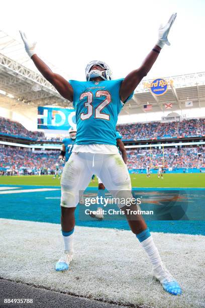 Kenyan Drake of the Miami Dolphins celebrates after scoring a tocuhdown in the third quarter against the Denver Broncos at the Hard Rock Stadium on...