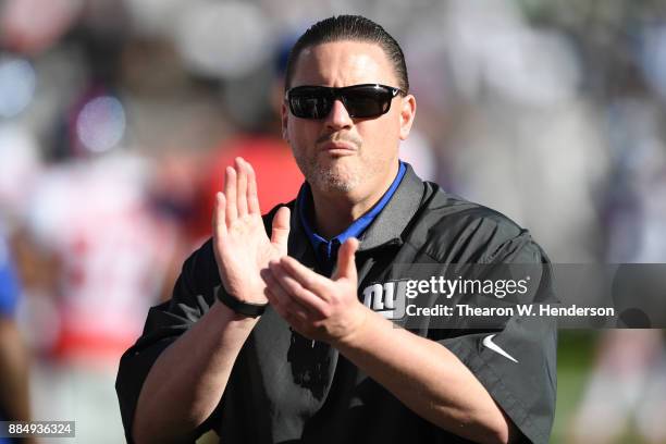 Head coach Ben McAdoo of the New York Giants looks on during warm ups prior to their NFL game against the Oakland Raiders at Oakland-Alameda County...