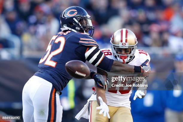 Christian Jones of the Chicago Bears attempts to break up the pass intended for Louis Murphy of the San Francisco 49ers at Soldier Field on December...