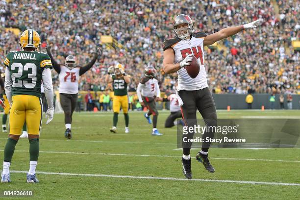 Cameron Brate of the Tampa Bay Buccaneers celebrates a touchdown against the Green Bay Packers during the second half at Lambeau Field on December 3,...