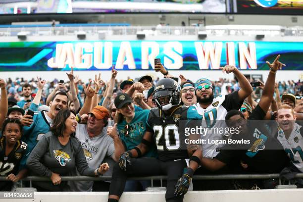 Jalen Ramsey of the Jacksonville Jaguars celebrates with fans after the Jaguars defeated the Indianapolis Colts 30-10 at EverBank Field on December...