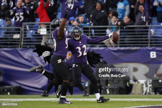 Free Safety Eric Weddle of the Baltimore Ravens returns an interception for a touchdown in the fourth quarter against the Detroit Lions at M&T Bank...