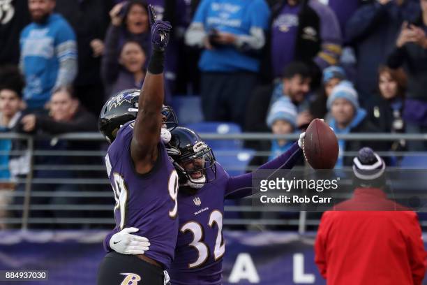 Free Safety Eric Weddle and outside linebacker Matt Judon of the Baltimore Ravens celebrate a touchdown in the fourth quarter against the Detroit...
