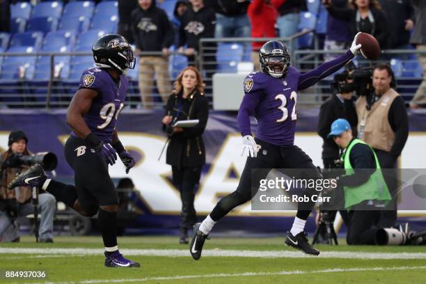 Free Safety Eric Weddle of the Baltimore Ravens returns an interception for a touchdown in the fourth quarter against the Detroit Lions at M&T Bank...