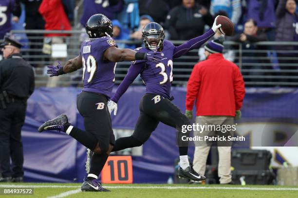 Free Safety Eric Weddle of the Baltimore Ravens returns an interception for a touchdown in the fourth quarter against the Detroit Lions at M&T Bank...