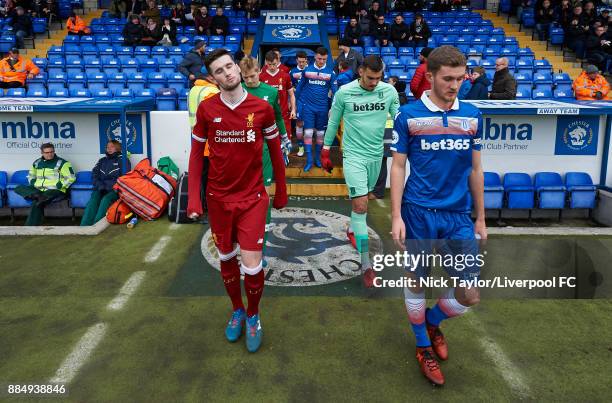 Corey Whelan of Liverpool and Lewis Banks of Stoke City lead their teams to the pitch during the Liverpool v Stoke City Premier League Cup game at...