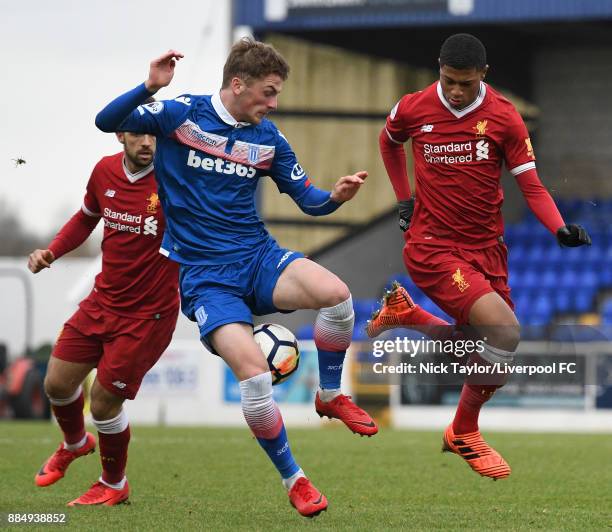 Rhian Brewster of Liverpool and Joshua Tymon of Stoke City in action during the Liverpool v Stoke City Premier League Cup game at The Swansway...