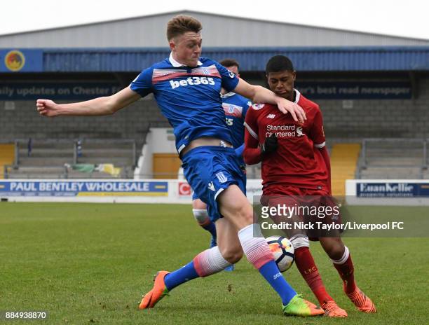 Rhian Brewster of Liverpool and Harry Souttar of Stoke City in action during the Liverpool v Stoke City Premier League Cup game at The Swansway...