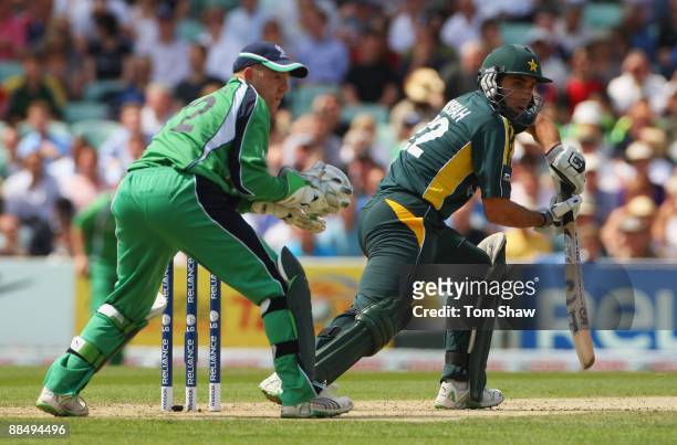 Misbah-ul-Haq of Pakistan hits out watched by Niall O'Brien of Ireland during the ICC World Twenty20 Super Eights match between Ireland and Pakistan...