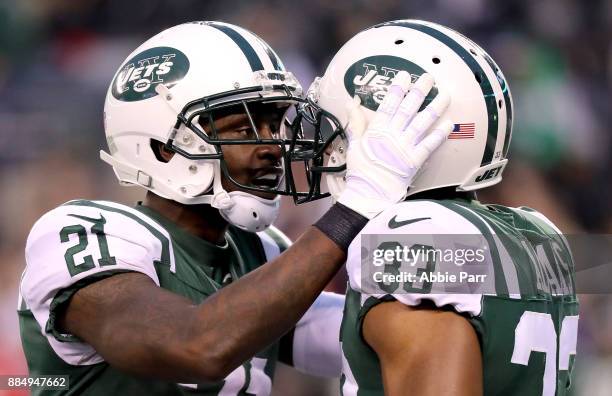 Morris Claiborne and Jamal Adams of the New York Jets celebrate after holding the Kansas City Chiefs on fourth down late in the fourth quarter during...