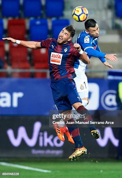 Sergi Enrich of SD Eibar duels for the ball with Javier Fuego Martinez of RCD Espanyol during the La Liga match between SD Eibar and RCD Espanyol at...