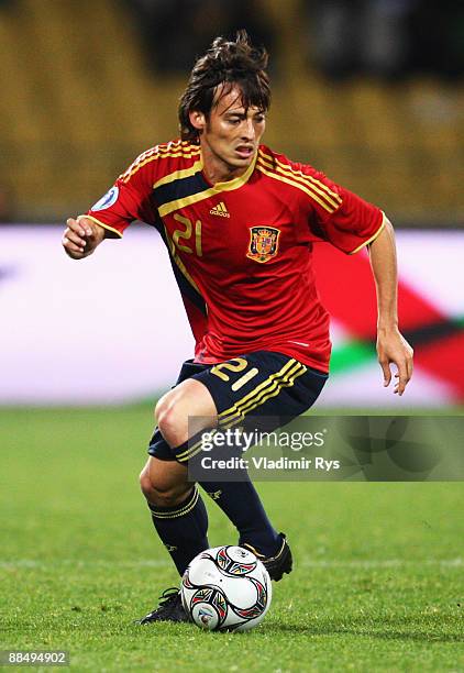 David Silva of Spain runs with the ball during the FIFA Confederations Cup match between New Zealand and Spain at Royal Bafokeng Stadium on June 14,...