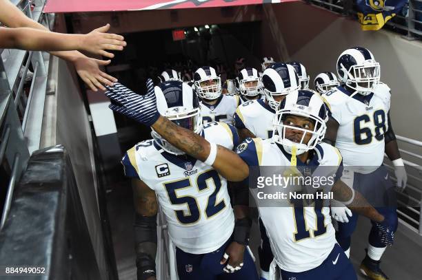 Wide receiver Tavon Austin of the Los Angeles Rams high fives a fan before the NFL game against the Arizona Cardinals at the University of Phoenix...