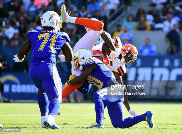 Desmond King of the Los Angeles Chargers hits Josh Gordon of the Cleveland Browns during the second quarter of the game at StubHub Center on December...