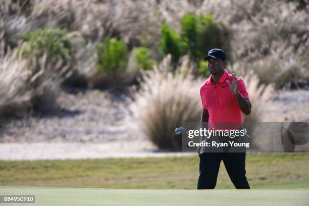 Tiger Woods acknowledges the crowd on the 14th hole during the final round of the Hero World Challenge at Albany course on December 3, 2017 in...