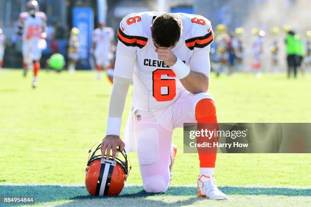 Cody Kessler of the Cleveland Browns kneels and prays prior to the start of the game against the Los Angeles Chargers at StubHub Center on December...