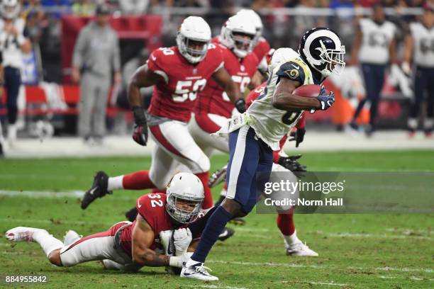 Wide receiver Mike Thomas of the Los Angeles Rams runs past free safety Tyrann Mathieu of the Arizona Cardinals during the first half of the NFL game...