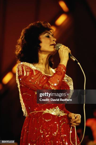 American singer Loretta Lynn performs on stage at the Country Music Festival held at Wembley Arena, London in 1985.