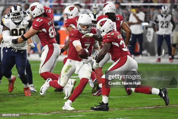 Quarterback Blaine Gabbert of the Arizona Cardinals hands off to running back Kerwynn Williams of the Arizona Cardinals during the first half of the...