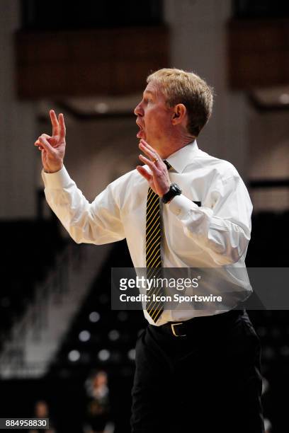 Jimmy Garrity head coach womens basketball Wofford College Terriers gestures from the sideline during the game against the UNC Asheville Bulldogs,...
