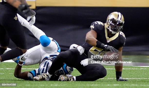 New Orleans Saints running back Mark Ingram gets up after being tackled by Carolina Panthers cornerback Daryl Worley after a long run during the...