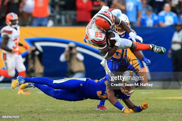 Tre Boston of the Los Angeles Chargers upends David Njoku of the Cleveland Browns on a short pass play during the second half of a game at StubHub...