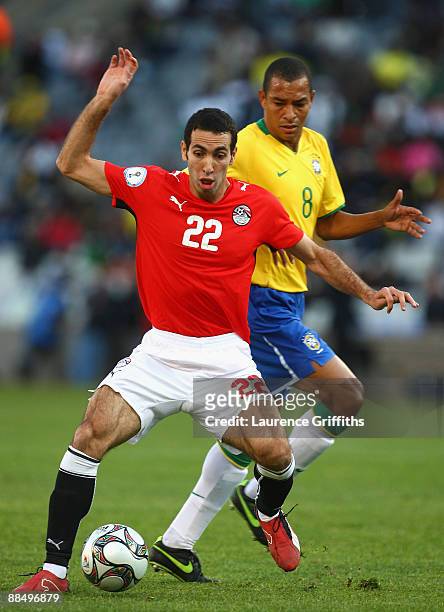 Mohamed Aboutrika of Egypt battles with Gilberto Silva of Brazil during the FIFA Confederations Cup match between Brazil and Egypt at The Free State...