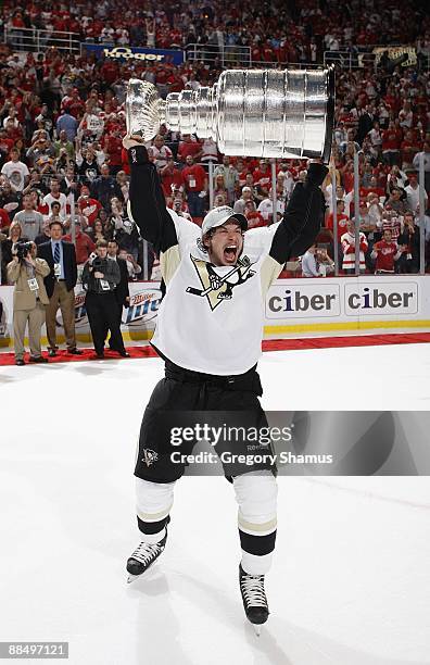 Sidney Crosby of the Pittsburgh Penguins celebrates with the Stanley Cup after defeating the Detroit Red Wings 2-1 in Game Seven to win the 2009...