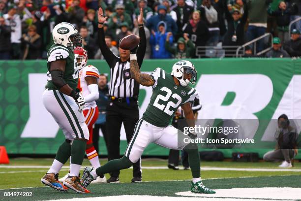 New York Jets running back Matt Forte spikes the ball after he scores a touchdown during the second quarter of the National Football League game...