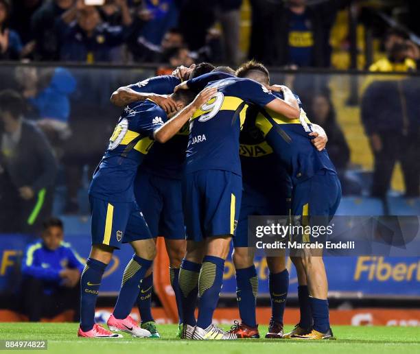 Edwin Cardona of Boca Juniors celebrates with teammates after scoring the second goal of his team during a match between Boca Juniors and Arsenal as...