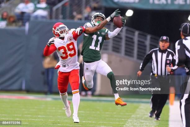 New York Jets wide receiver Robby Anderson makes a catch over Kansas City Chiefs cornerback Terrance Mitchell makes a catch and run during the third...
