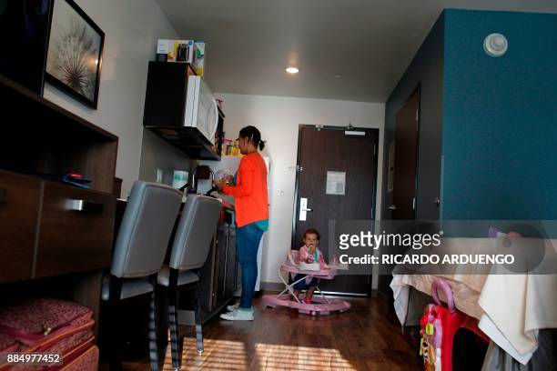 Deborah Oquendo prepare breakfast for her and her 10mo old daughter Genesis Rivera at the hotel were they are staying in Orlando, Florida on December...