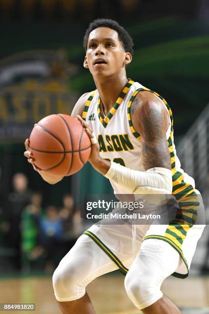 Javon Greene of the George Mason Patriots takes a foul shot during a college basketball tournament against the Cal State Northridge Matadors at the...