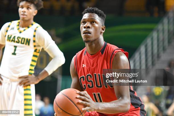 Tavrion Dawson of the Cal State Northridge Matadors takes a foul shot during a college basketball tournament against the George Mason Patriots at the...