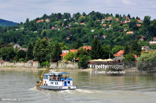 Hungary, Central Hungary, Pest County, Danube, ship on the Danube near by Visegrad, hilly landscape, riverwalk, residential houses situated on a slope