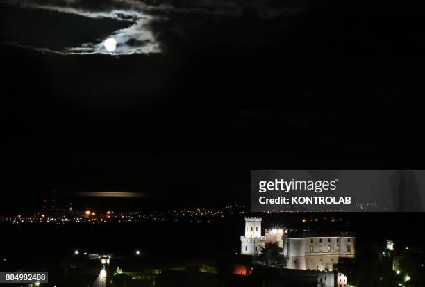 The Super moon of 2017, the only moment in 2017 year when the moon looks much bigger. Here it is seem above the Castle of Corigliano, in Calabria,...