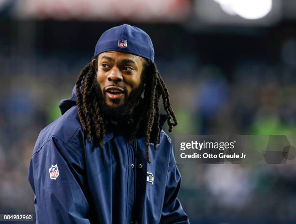 Injured cornerback Richard Sherman of the Seattle Seahawks smiles from the sidelines before the game against the Philadelphia Eagles at CenturyLink...