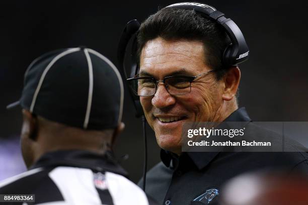 Head coach Ron Rivera of the Carolina Panthers talks to an official during the first half of a game against the New Orleans Saints at the...