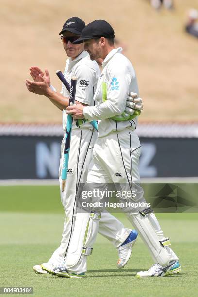 Tom Blundell of New Zealand is applauded by teammate Neil Wagner at the end of the match on day four of the Test match series between New Zealand...