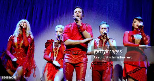 Ian 'H' Watkins, Lisa Scott-Lee, Claire Richards, Faye Tozer and Lee Latchford-Evans of Steps perform live on stage at Manchester Arena on December...
