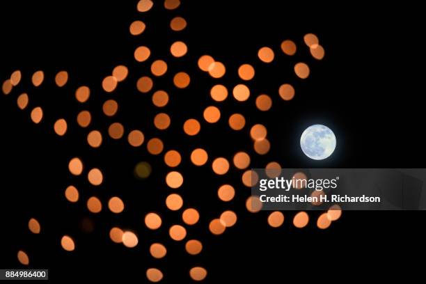 December's Supermoon shines brightly in the sky above the small town on December 3, 2017 in Denver, Colorado. The next full moon will not be until...