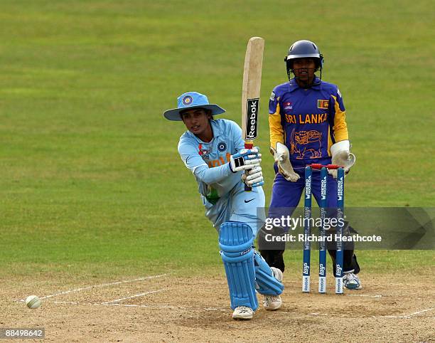 Mithali Raj of India drives the ball away during the ICC Women's Twenty20 World Cup match between India and Sri Lanka at The County Ground on June...