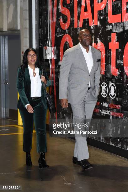 Former basketball player Magic Johnson and wife Cookie Johnson arrives at the stadium before Los Angeles Lakers vs Houston Rockets game on December...