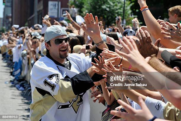 Petr Sykora of the Pittsburgh Penguins greets fans on the Blvd of the Allies during Stanley Cup Champion Victory Parade on June 15, 2009 in...