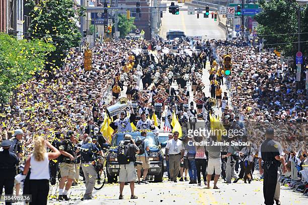 Marc-Andre Fleury and Sidney Crosby of the Pittsburgh Penguins proceed down the Blvd of the Allies with the Stanley Cup during Stanley Cup Champion...