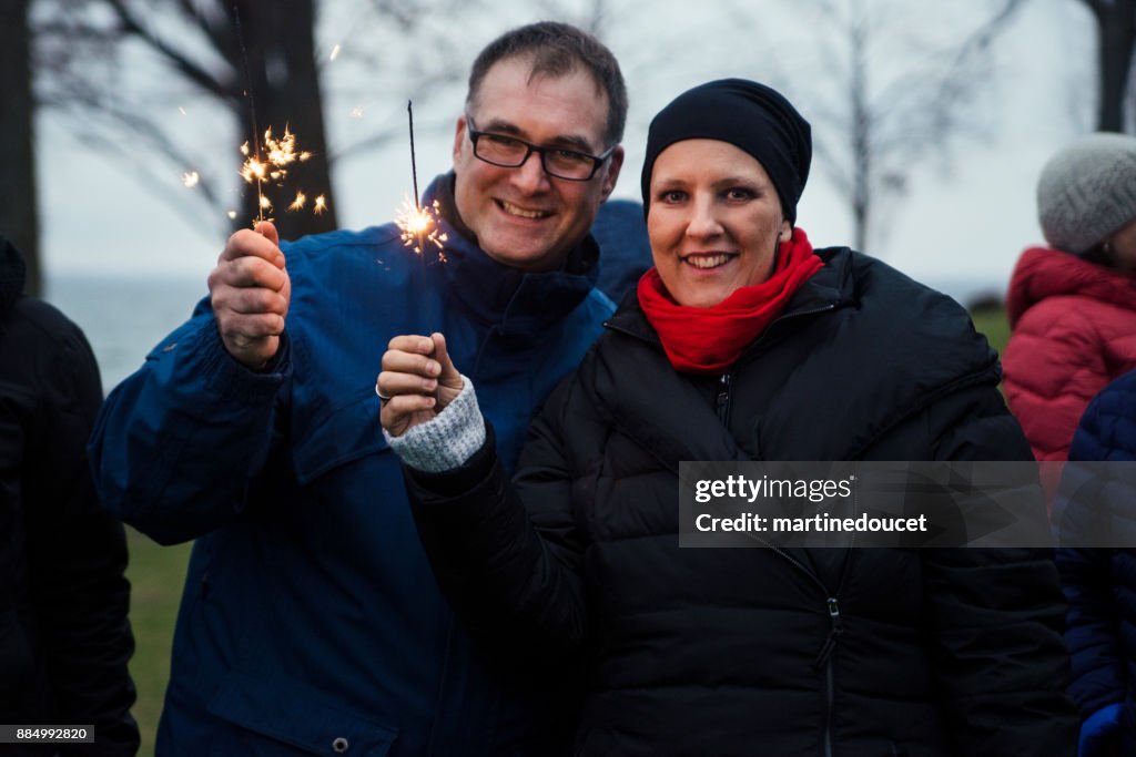 Mature couple celebrating life of cancer patient outdoors winter