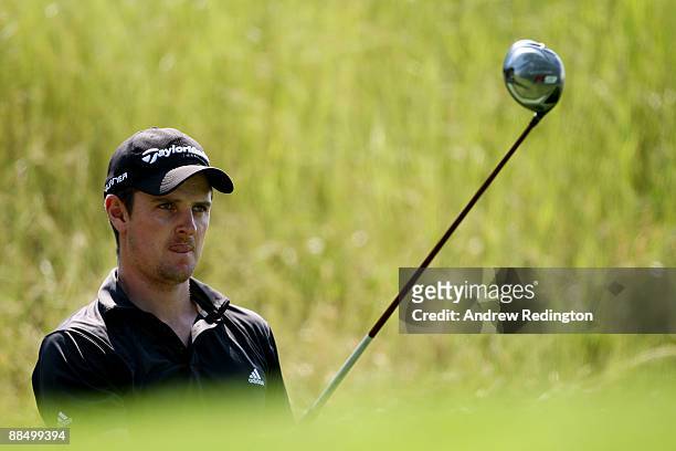 Justin Rose of England watches his shot during the first day of previews to the 109th U.S. Open on the Black Course at Bethpage State Park on June...