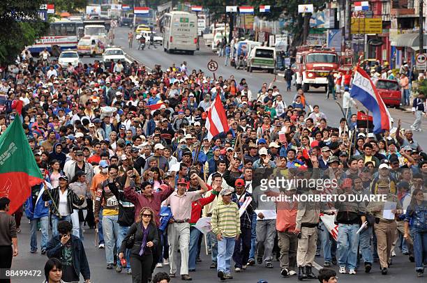 Members of the social movement "Sin Techo" march in Fernando de la Mora, 10 km east of Asuncion, Paraguay on June 15 demanding the government to...
