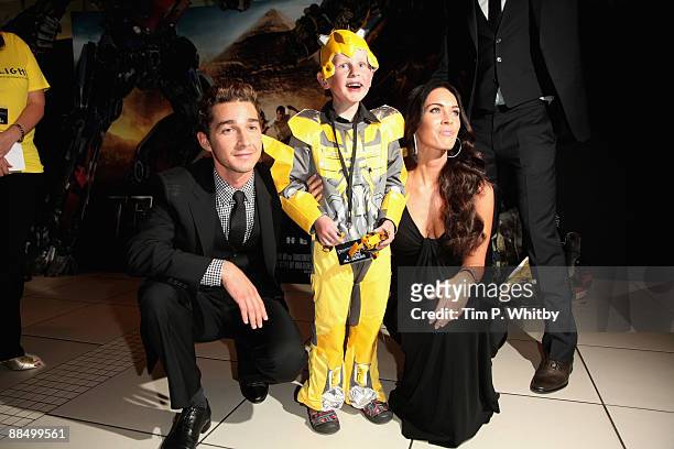 Actors, Shia LaBeouf and Megan Fox with Starlight Wish-child, Kai Hamilton at the UK Premiere of Transformers: Revenge of the Fallen at Odeon...